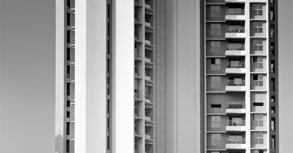 Black and white photograph of modern high-rise buildings in Mumbai, focusing on architectural details.